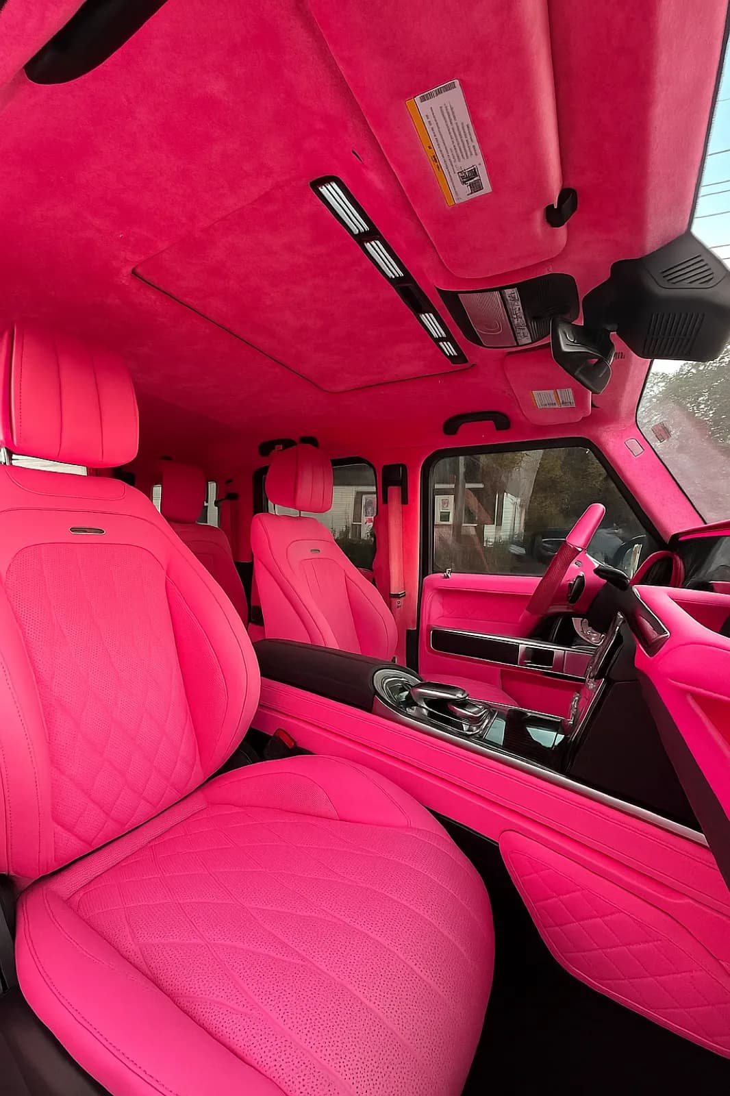 Hot pink quilted leather seats and door cards after a full interior color change