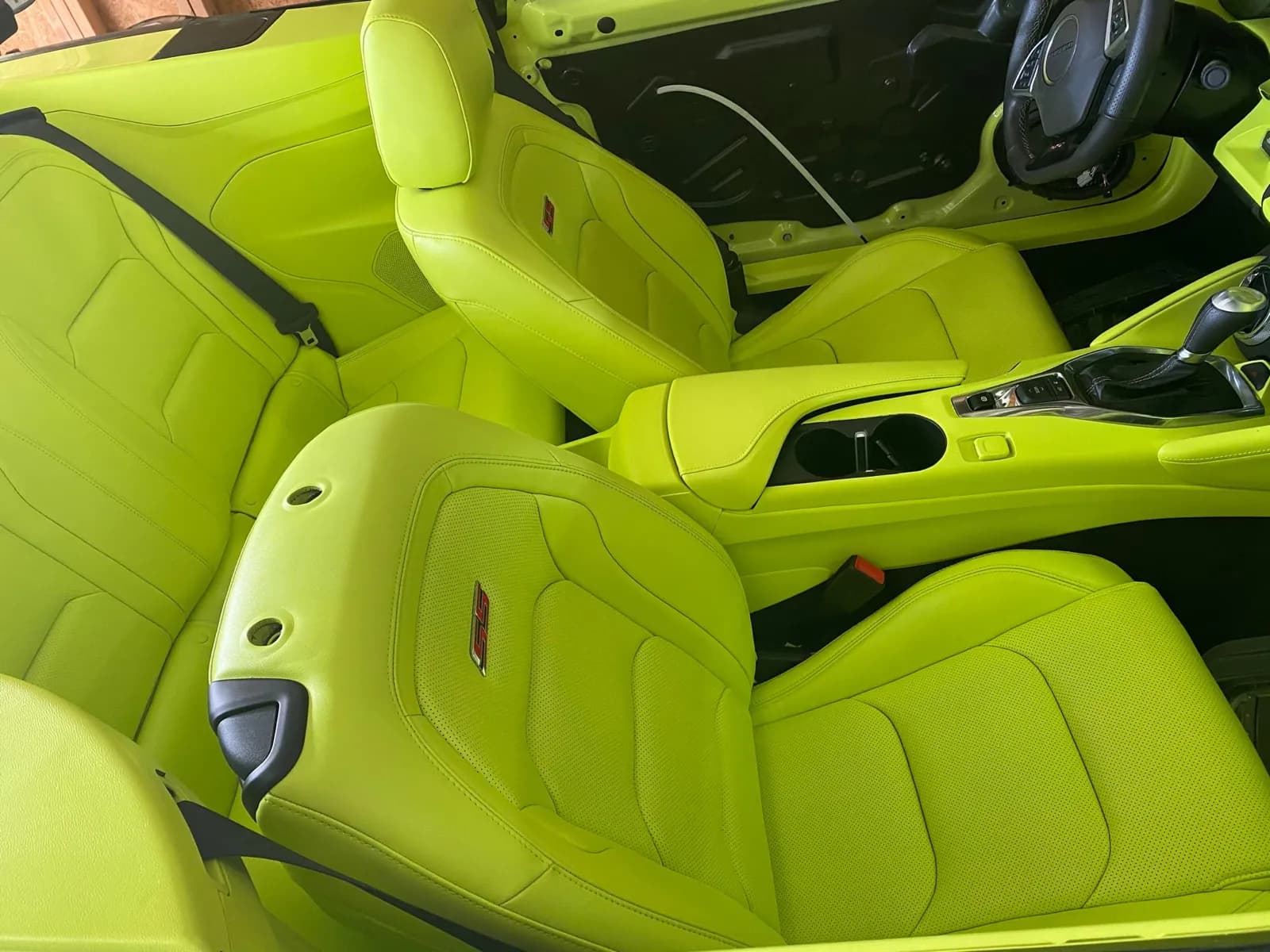 Close-up of neon lime leather seats after an interior color change