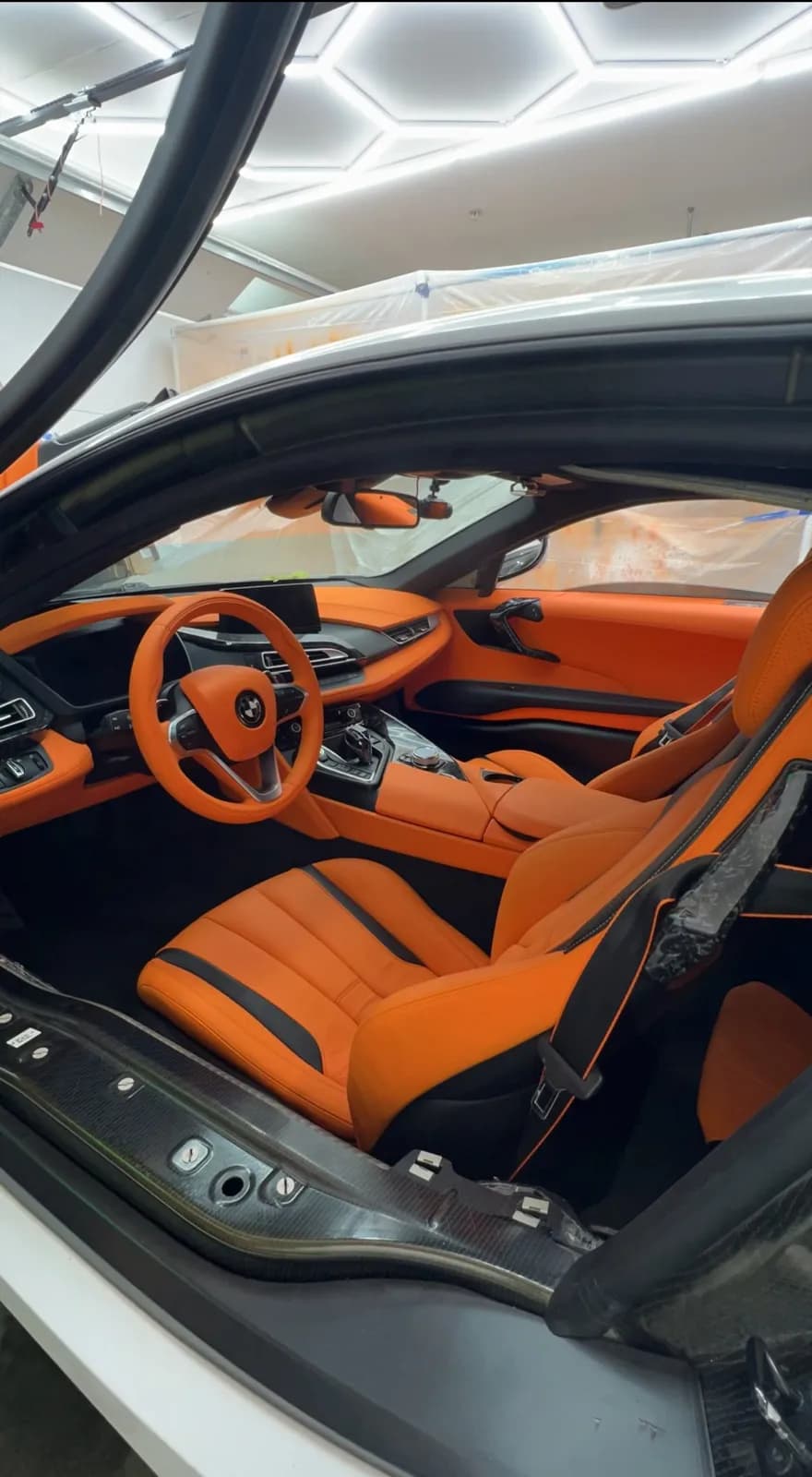 Exotic coupe interior with orange leather seats and trim