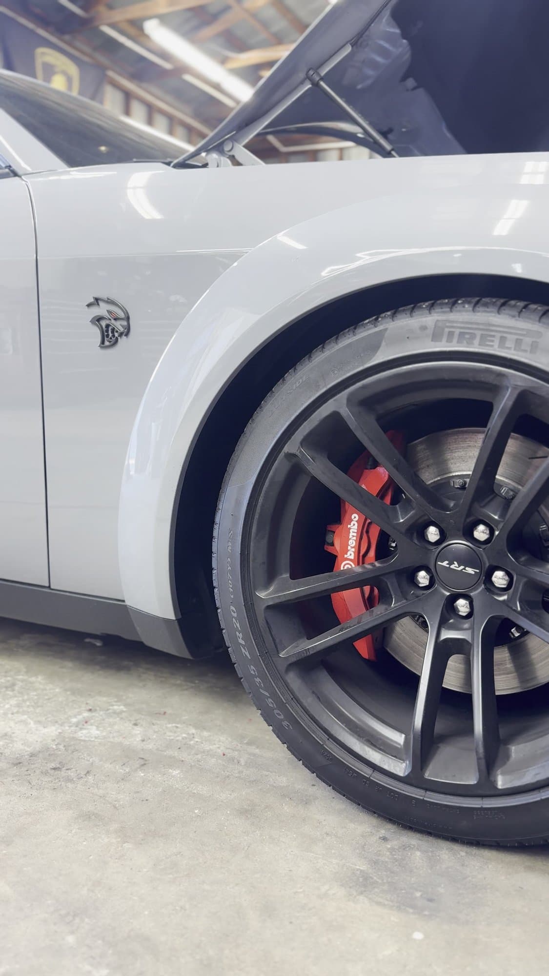 SRT Hellcat wheel with red Brembo brakes at Corsa Automotive in Orlando