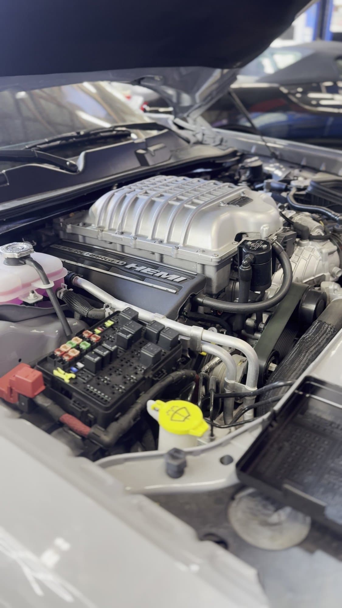 Supercharged 6.2L Hemi engine bay of an SRT Hellcat at Corsa Automotive