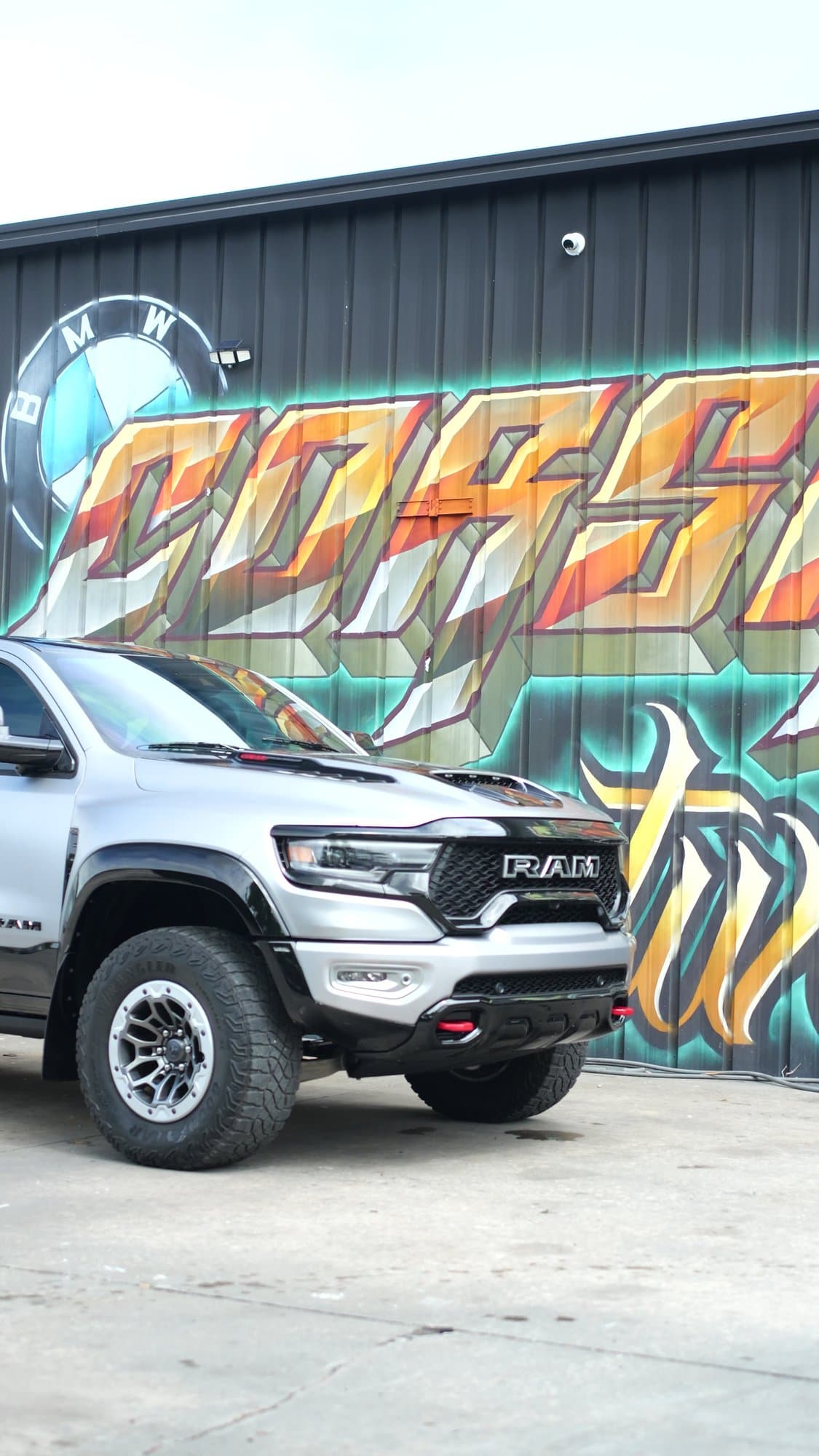 Silver Ram 1500 TRX in front of the Corsa Automotive mural in Orlando